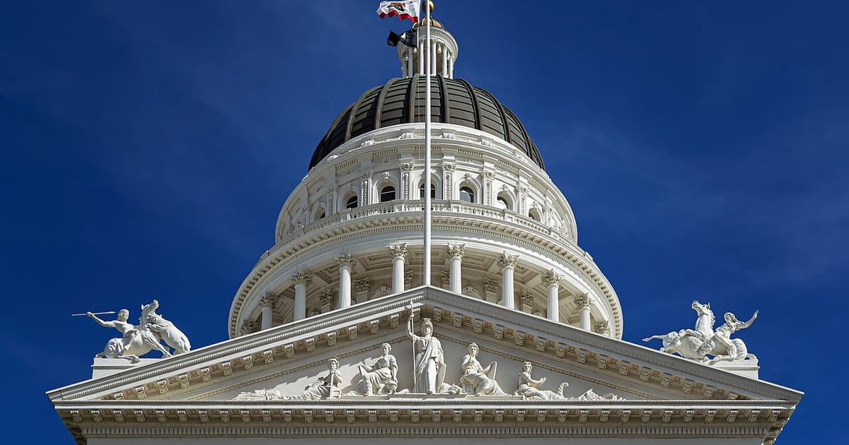 The dome of the California State Capitol against a clear blue sky